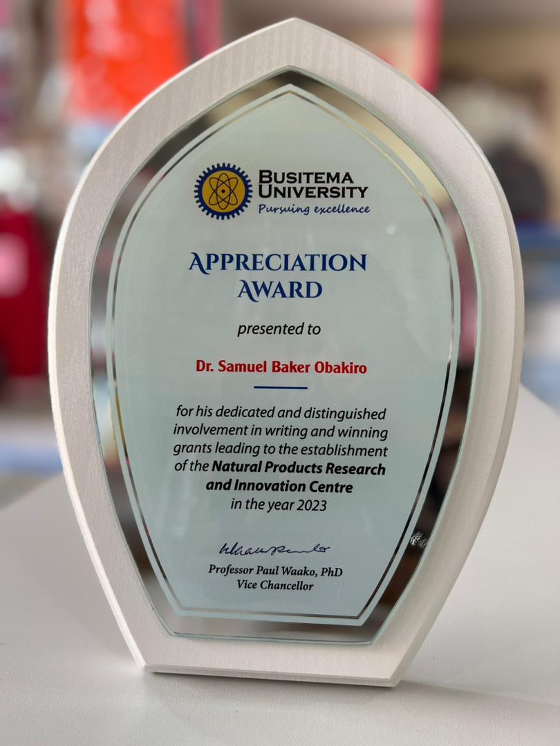Dr. Samuel Baker Obakiro receives an award
